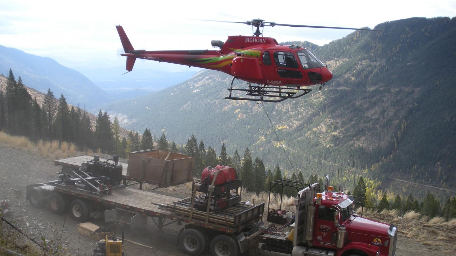 Helicopter mobilizing a drill rig from a semi-truck at the Wildhorse Project in Southeastern British Columbia Helicopter mobilizing a drill rig from a semi-truck at the Wildhorse Project in Southeastern British Columbia
