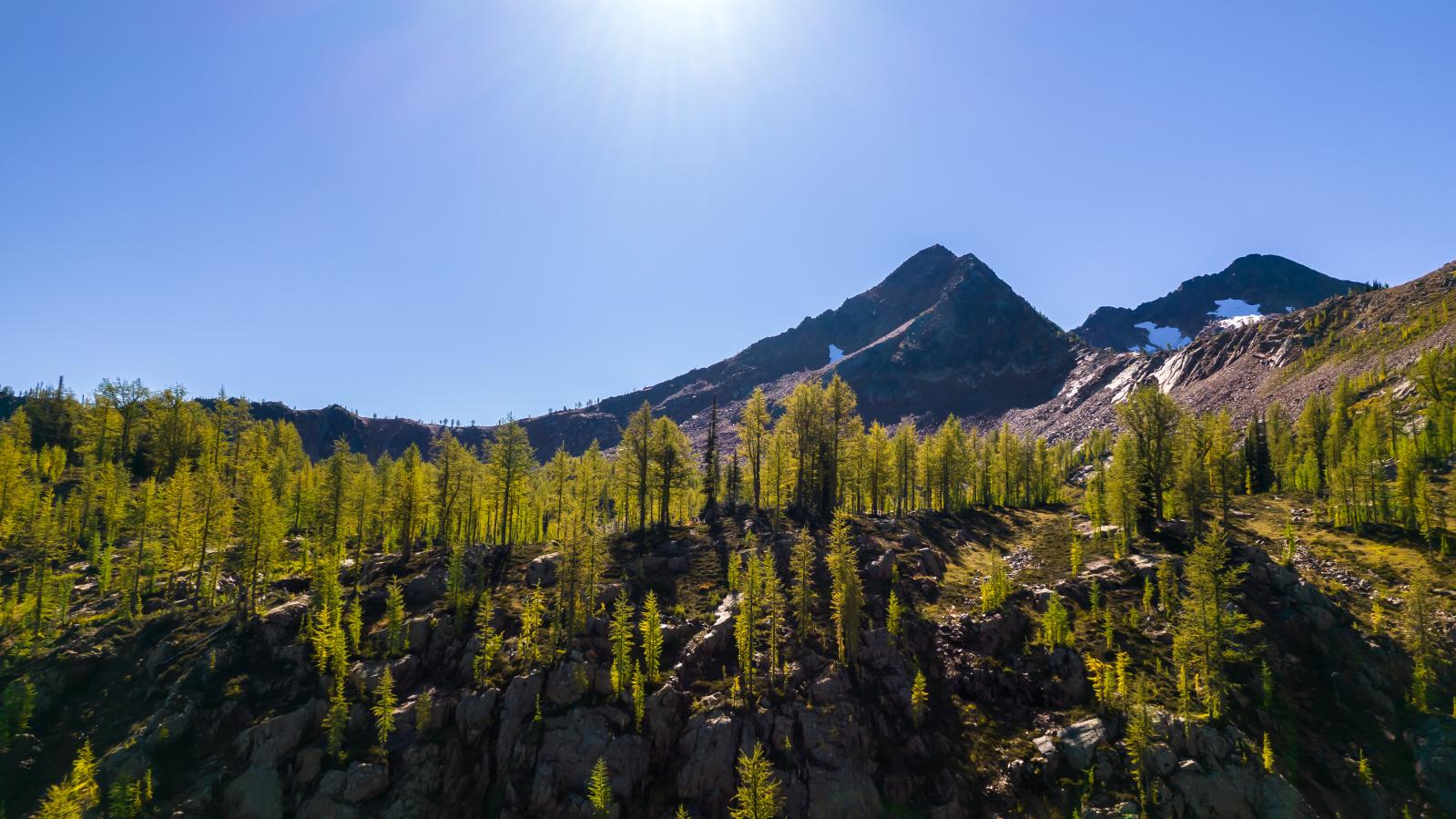 Sunlit vista of peaks from Vulcan 2022 Beautiful Mountain peak sunlit vista from Vulcan Project 2022