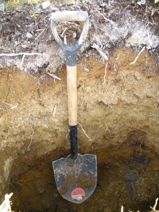 Pit excavating by hand at teh Dragon Lake Gold Exploration Project Yukon