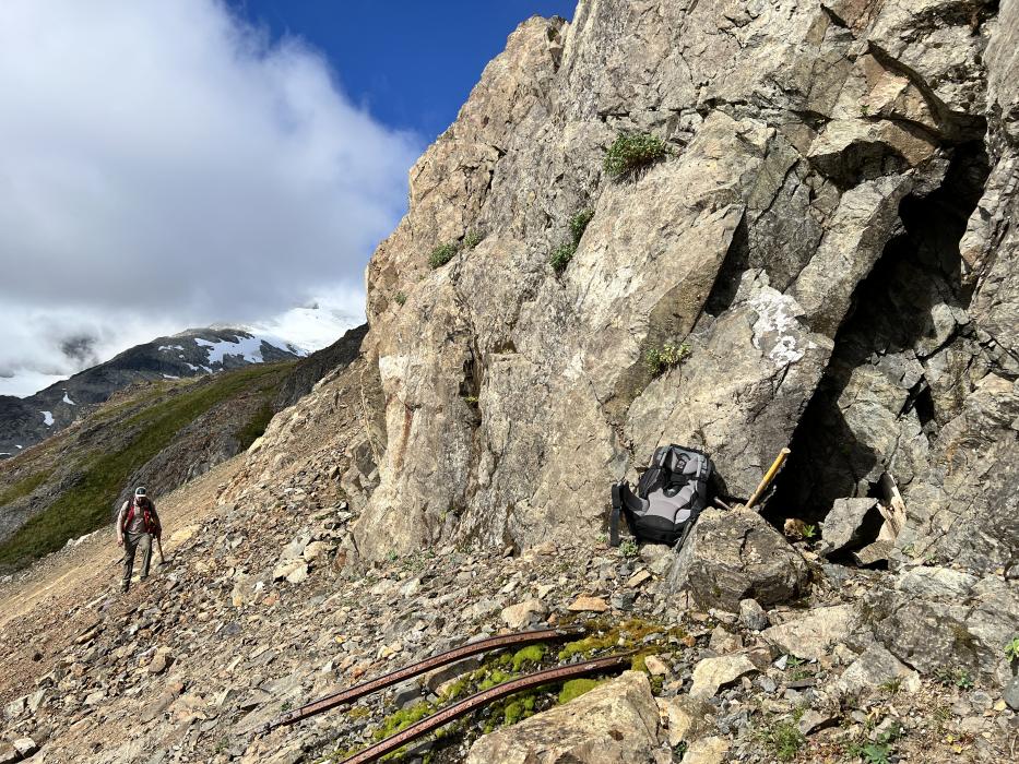 Prospecting geologist near the middle adit