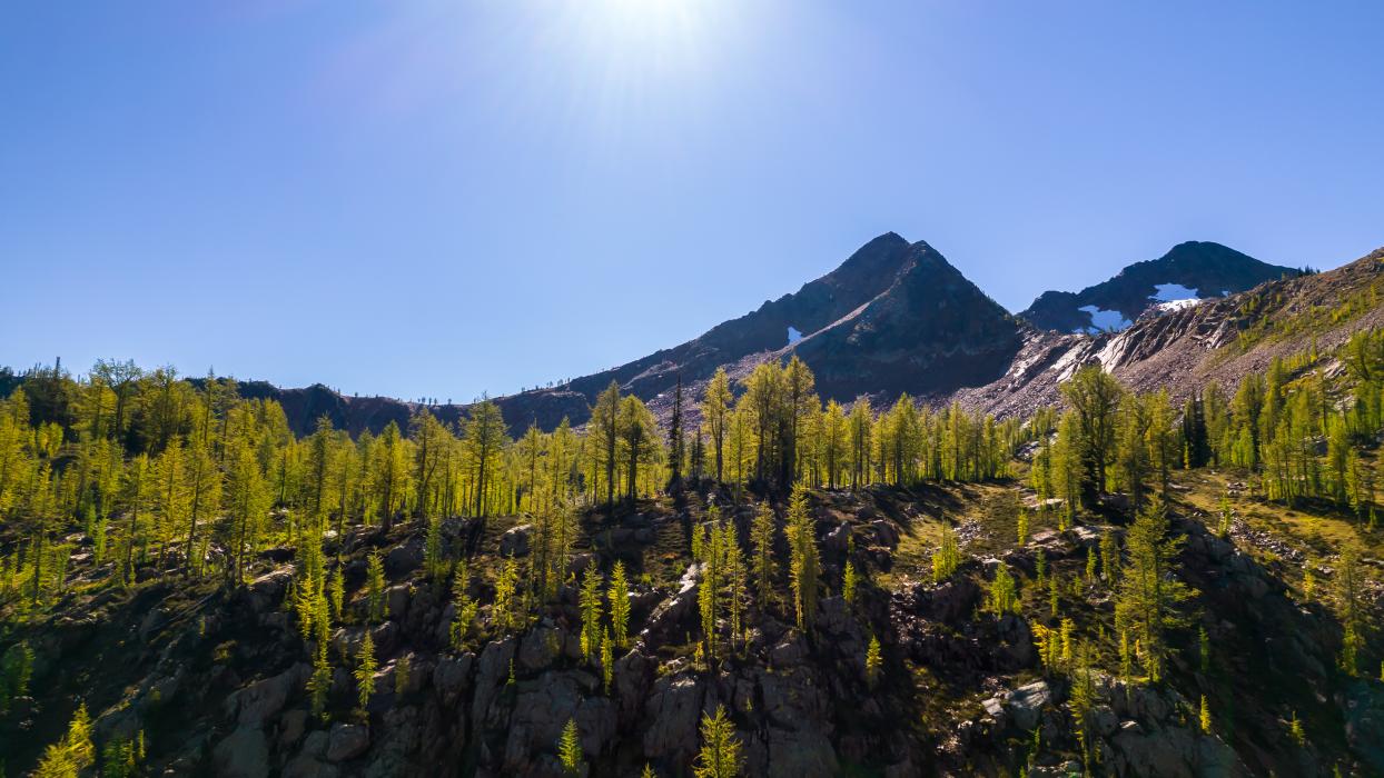 Sunlit vista of peaks from Vulcan 2022 Beautiful Mountain peak sunlit vista from Vulcan Project 2022